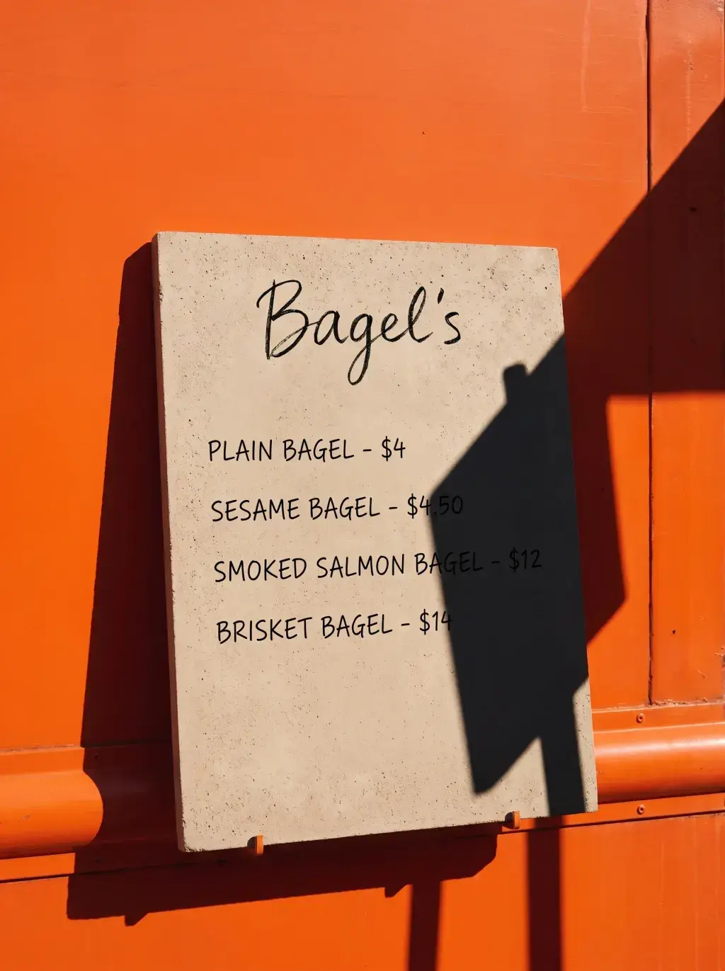 Panneau ardoise Bagel's avec menu des prix appuyé contre le food truck orange